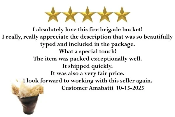 Customer review with a five-star rating, expressing love for a fire brigade bucket, complimenting the detailed typed description in the package, noting the good quality, quick shipping, and fair price, signed by customer Amabatti with a date of 10-15-2025. There is also a small image of a cupcake with a fire brigade bucket as a decoration.