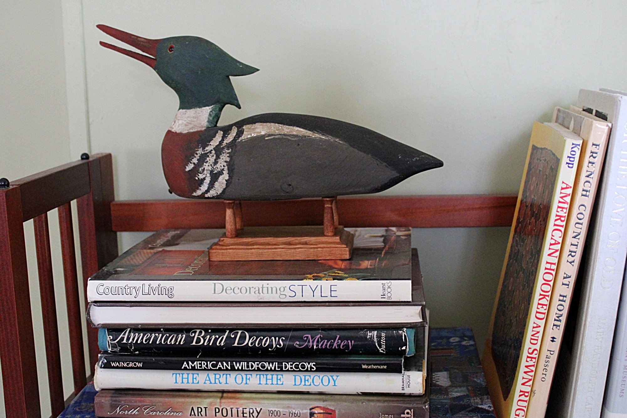 5757-CHARLES W. WATERFIELD Red Breasted Merganser Decoy-Sitting-on-books-Stand-2000 x 1333.JPG