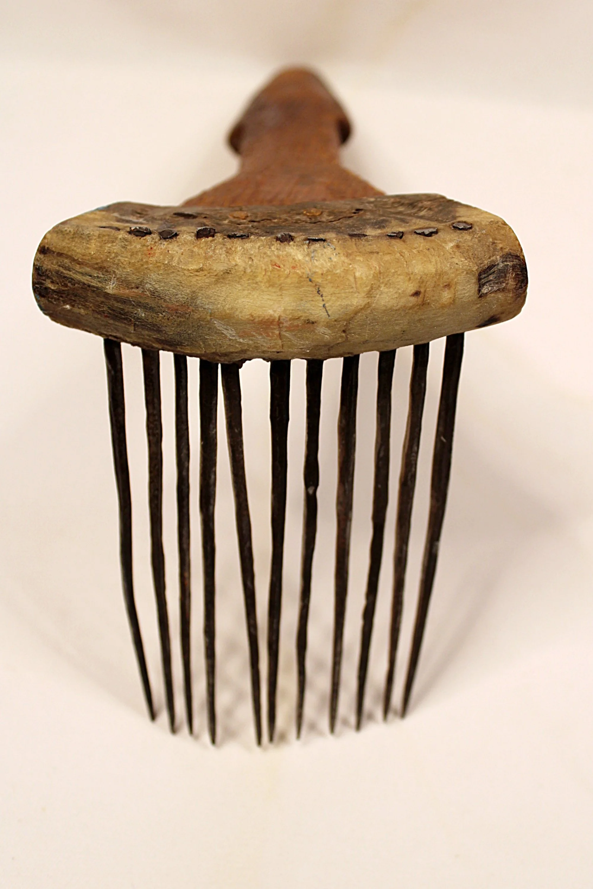 African Carved Wooden Fiber Comb with Forged Iron Spikes-Facing-Front-Spikes-down-handle-2000 x 3000.JPG