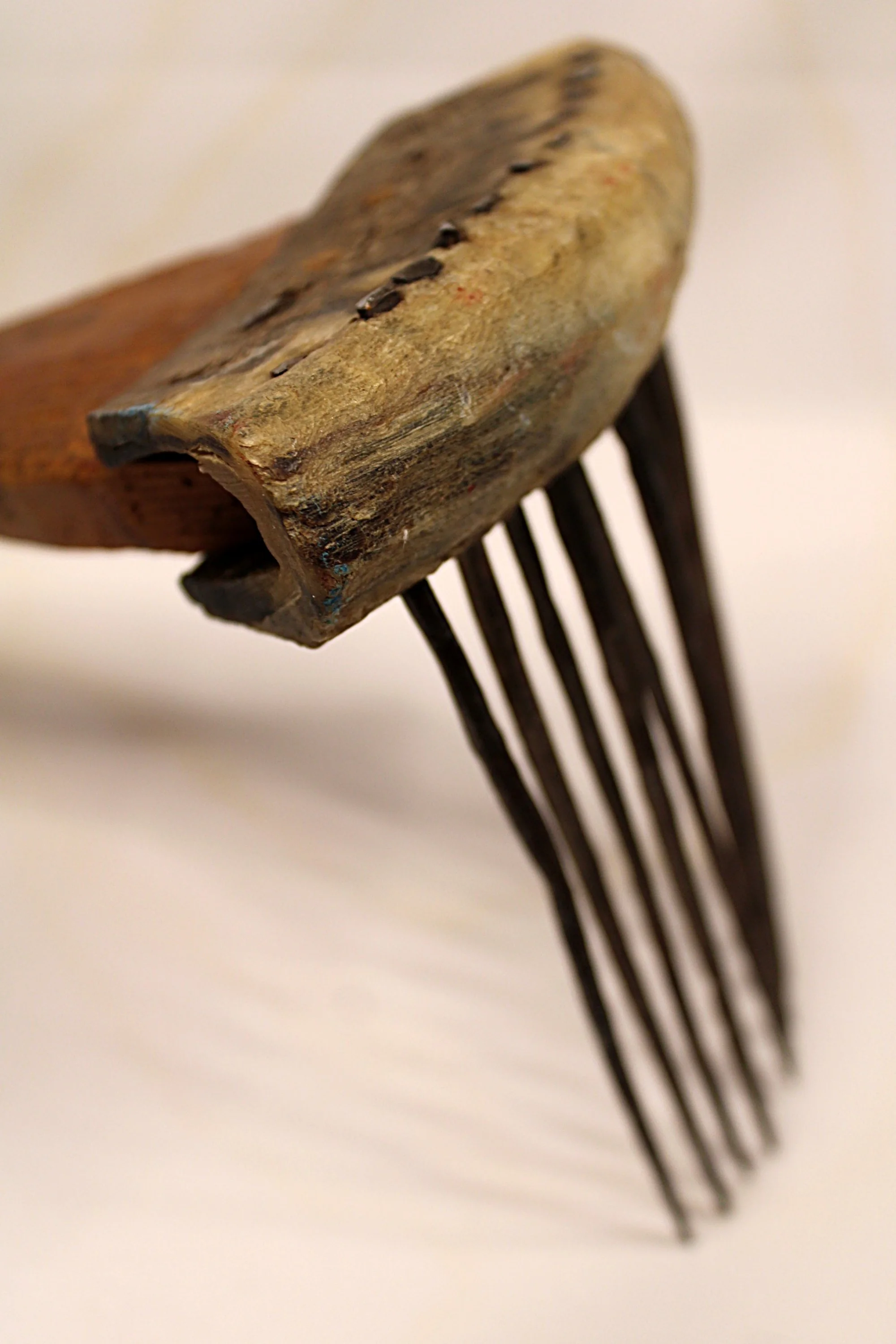 African Carved Wooden Fiber Comb with Forged Iron Spikes-Facing Right-Front-Spikes-down-2000 x 3000.JPG