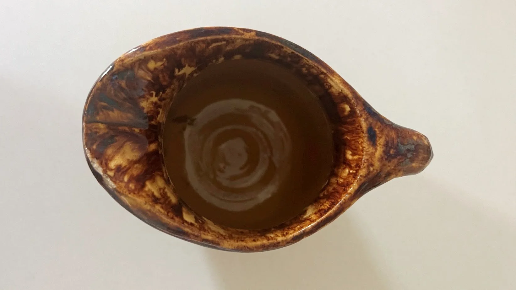 Antique Yellow Ware Batter Pitcher with Rockingham Glaze inside view-1643 x 924.jpg