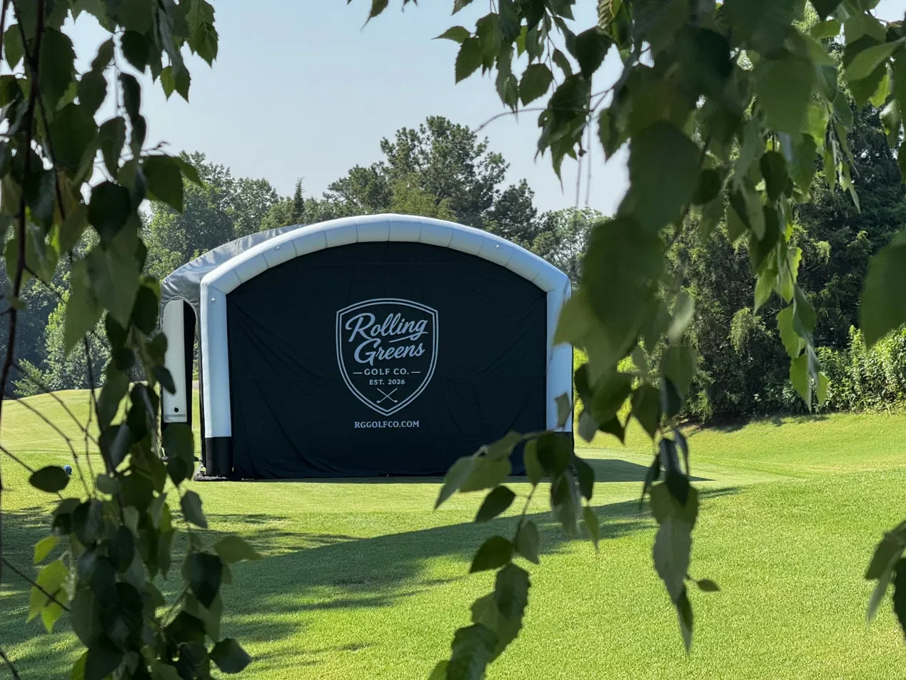Rolling Greens Golf Co. simulator enclosure on a golf course