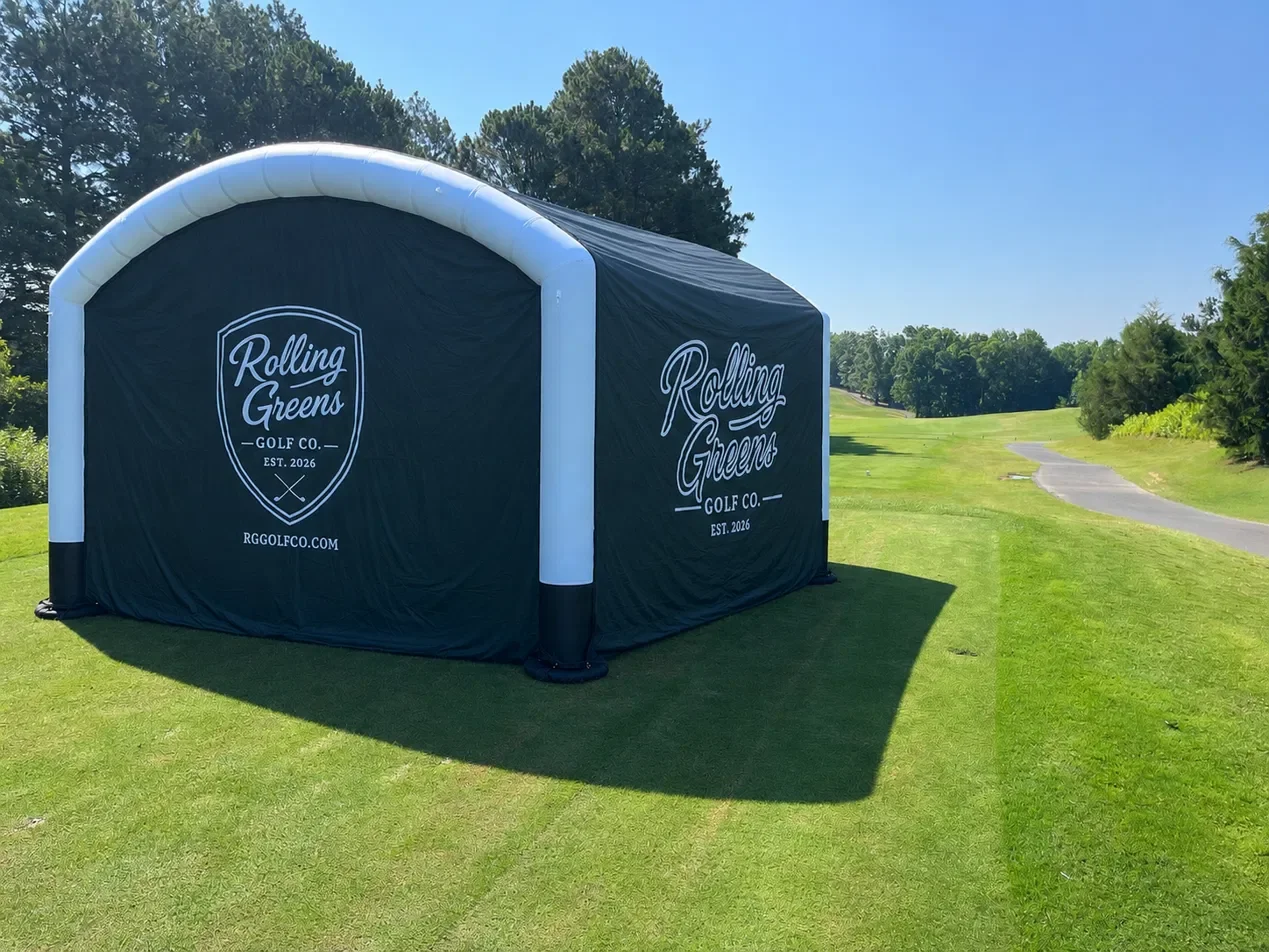 Rolling Greens Golf Co. branded mobile swing suite on a golf course