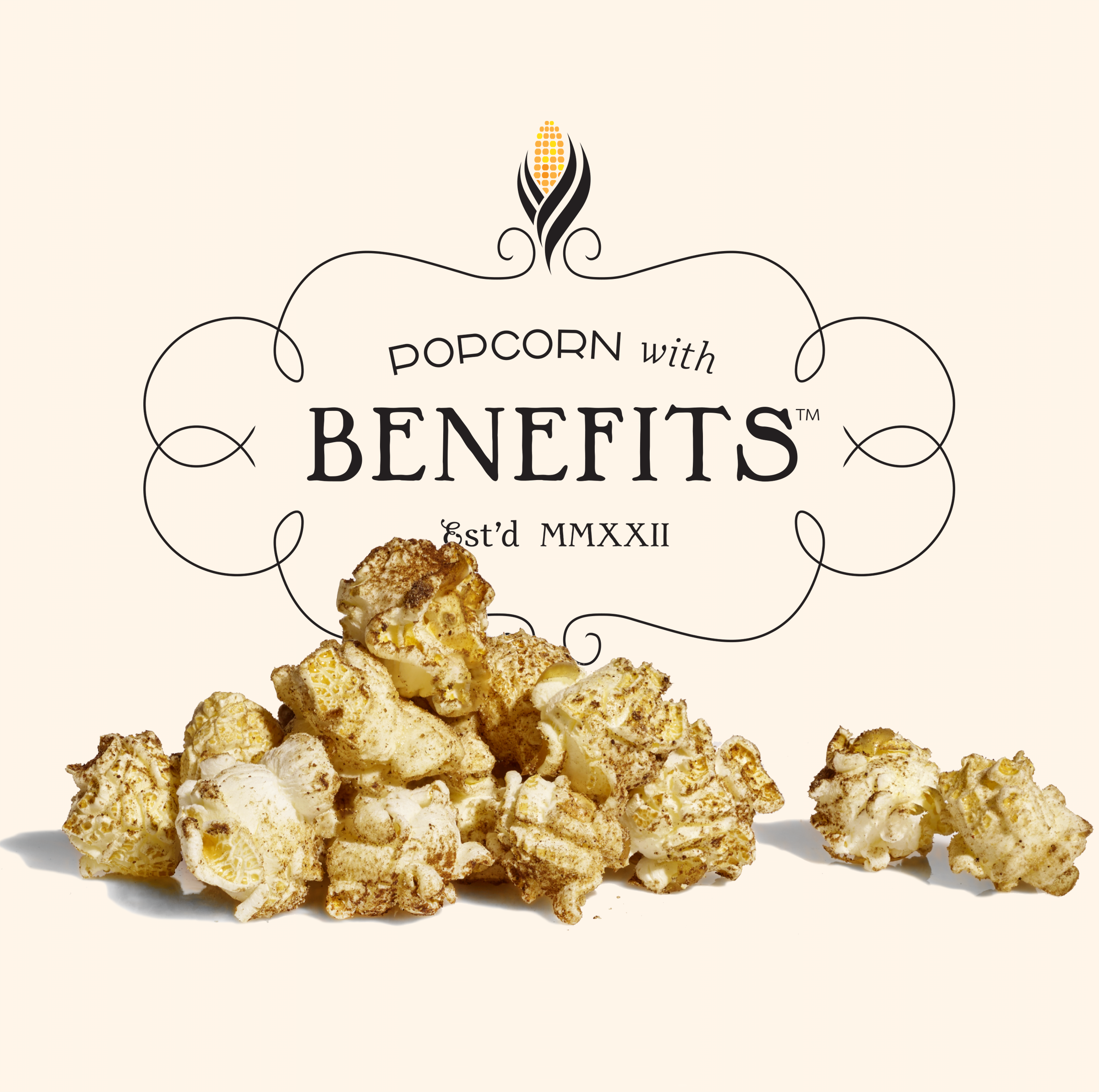 Vintage-style popcorn box with the text "Popcorn with Benefits est'd MMXXII" and a pile of caramel-coated popcorn in front.