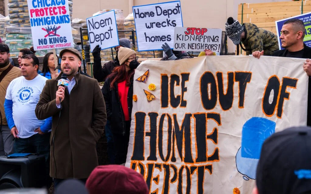 Miguel Alvelo-Rivera speaks at a protest against ICE in front of Home Depot