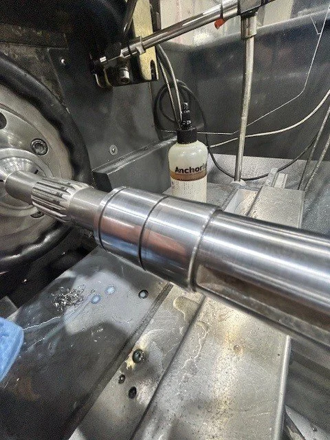 Repaired hydraulic pump shaft, sleeved and machined back to factory specs 