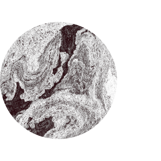 Close-up of a circular marble or stone surface with swirling gray, white, and black patterns.