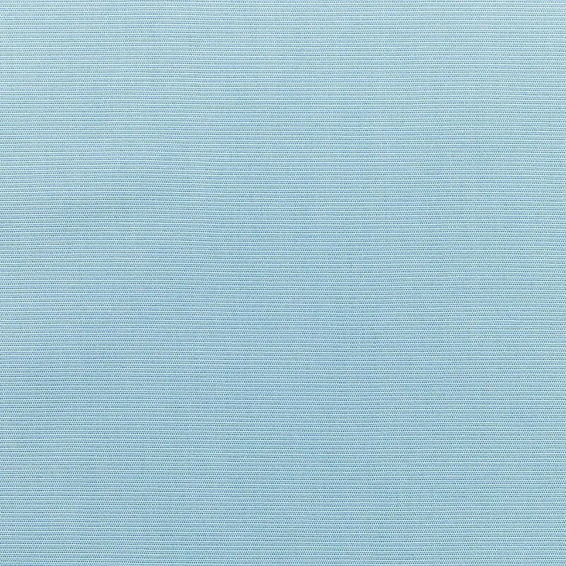 A blue textured fabric surface with small, evenly spaced dark dots.