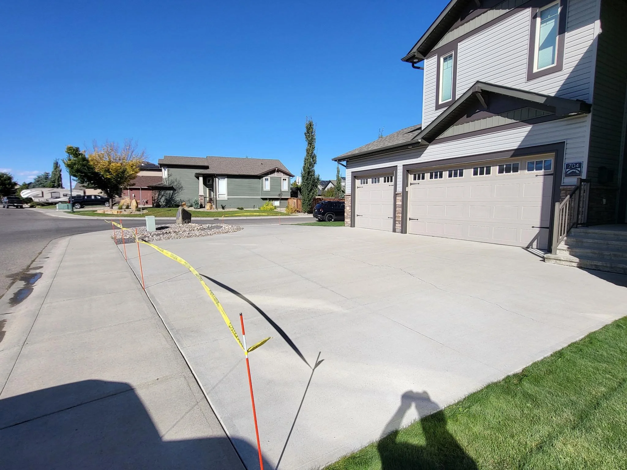 Large residential driveway in Lethbridge fully sealed and cured after professional concrete sealing