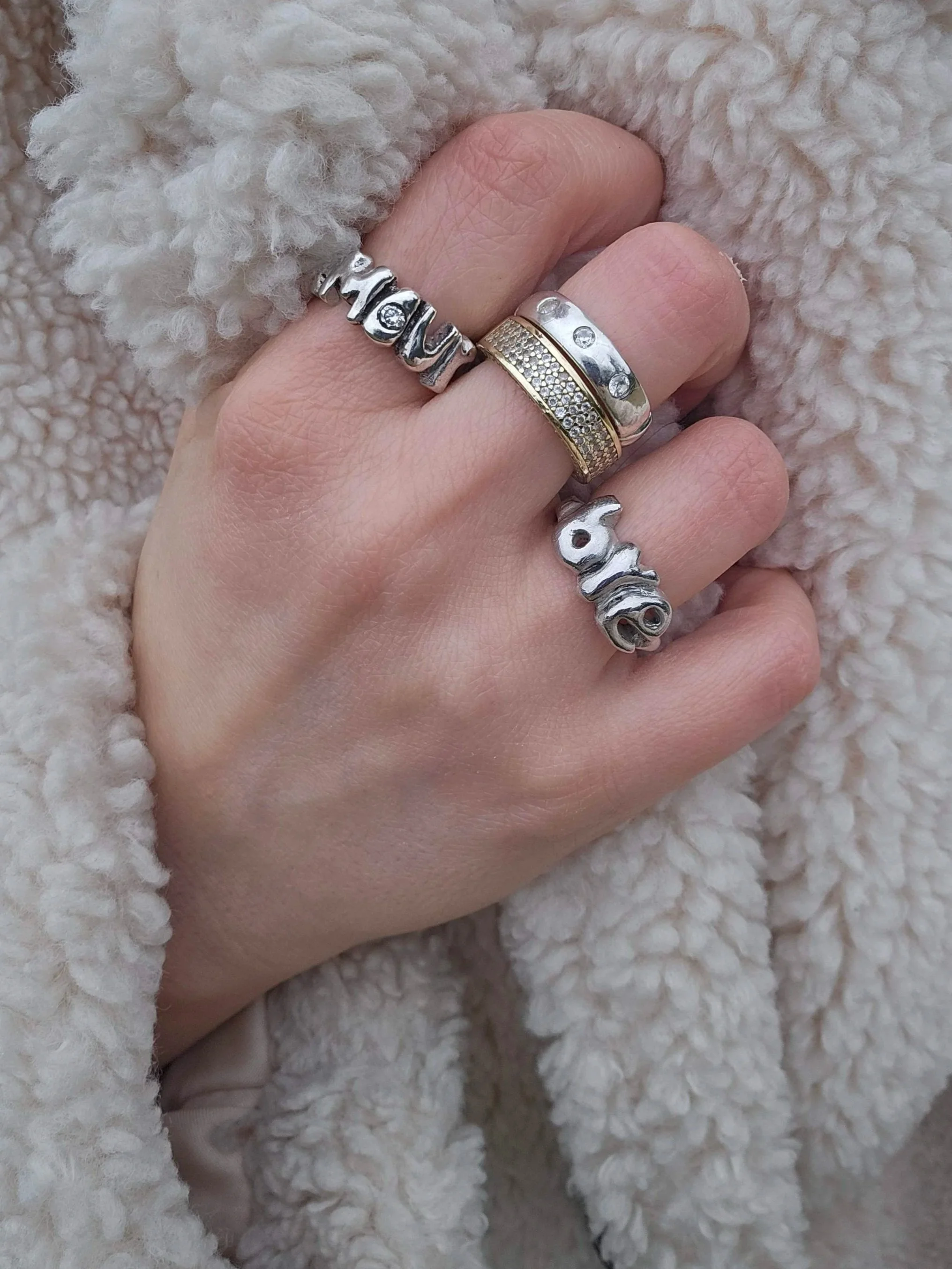 AMOUR Ring and BYE Ring stacked in sterling silver — hand-cast word rings, Atelier Moroti London