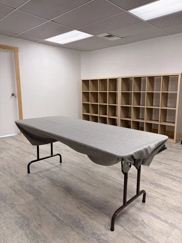 Folding table with grey cover at The Harlow Exchange Winnipeg