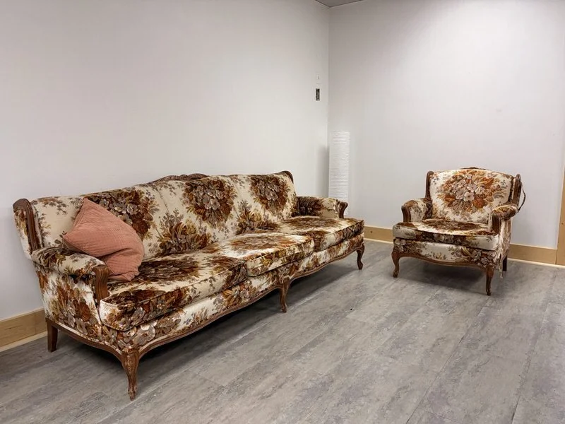 Vintage floral sofa and armchair set at The Harlow Exchange event venue in Winnipeg