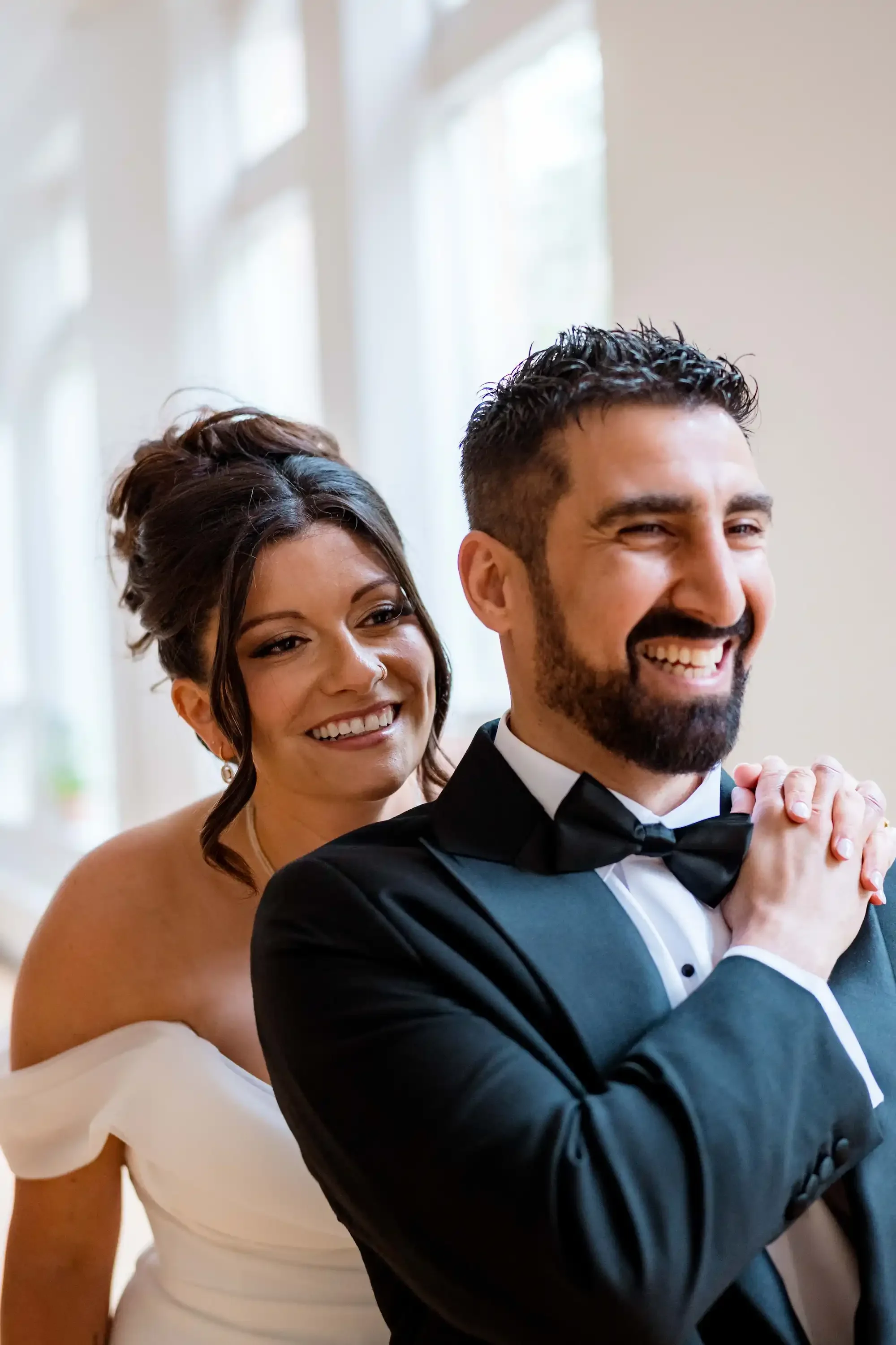 Bride and groom laughing at The Harlow Exchange wedding ceremony venue Winnipeg