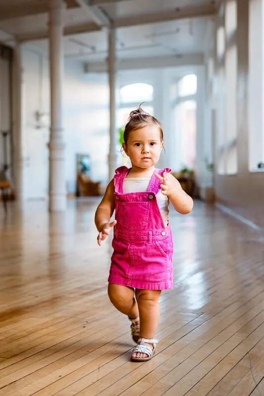 Child running through The Harlow Exchange event space in Winnipeg during a private celebration