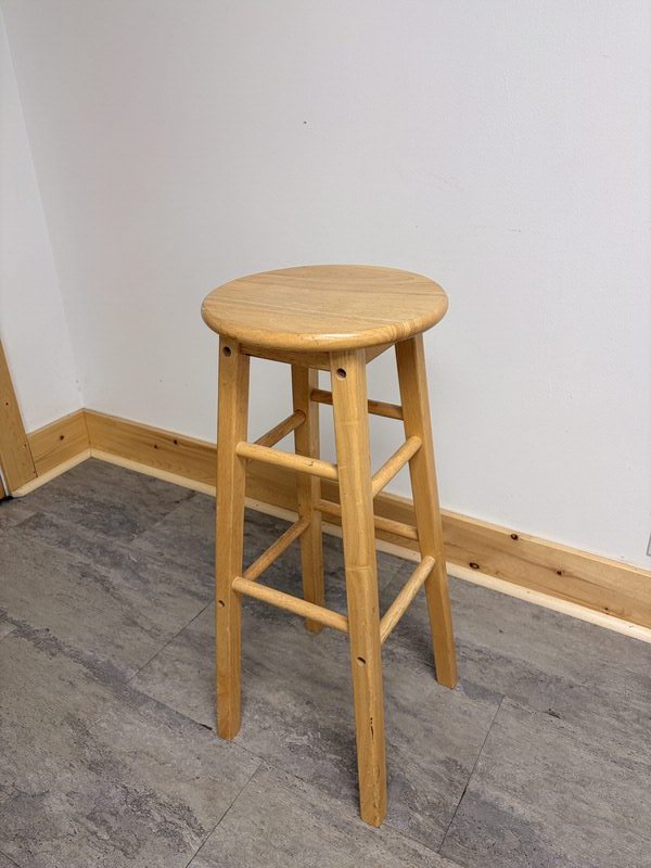 Wooden bar stool included with bookings at The Harlow Exchange event venue in Winnipeg