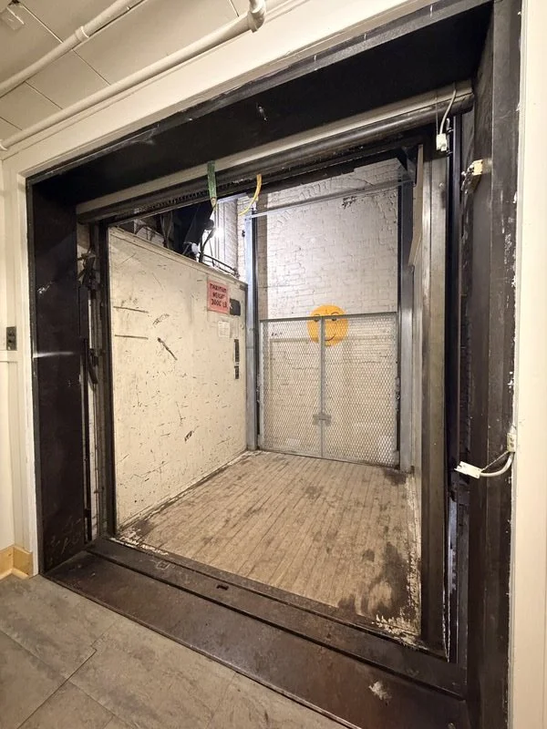 Large service elevator with direct rear alley access for vendor load-in at The Harlow Exchange event venue in Winnipeg's Exchange District