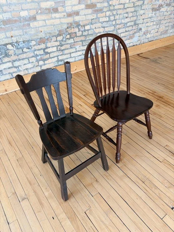 Two wooden chairs on hardwood floors at The Harlow Exchange heritage event venue in Winnipeg