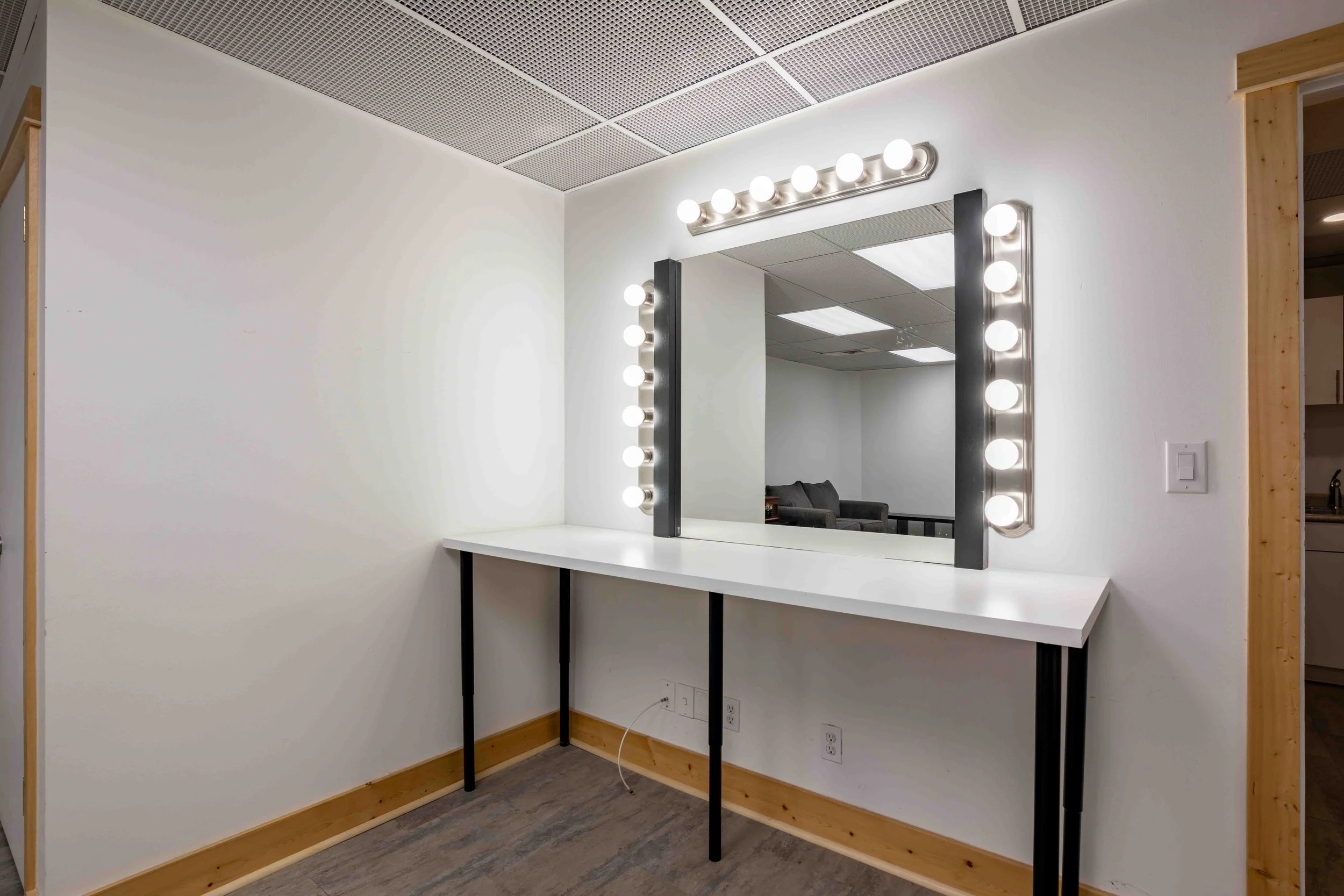 Hollywood vanity mirror with lights in the private getting ready room at The Harlow Exchange wedding venue in Winnipeg