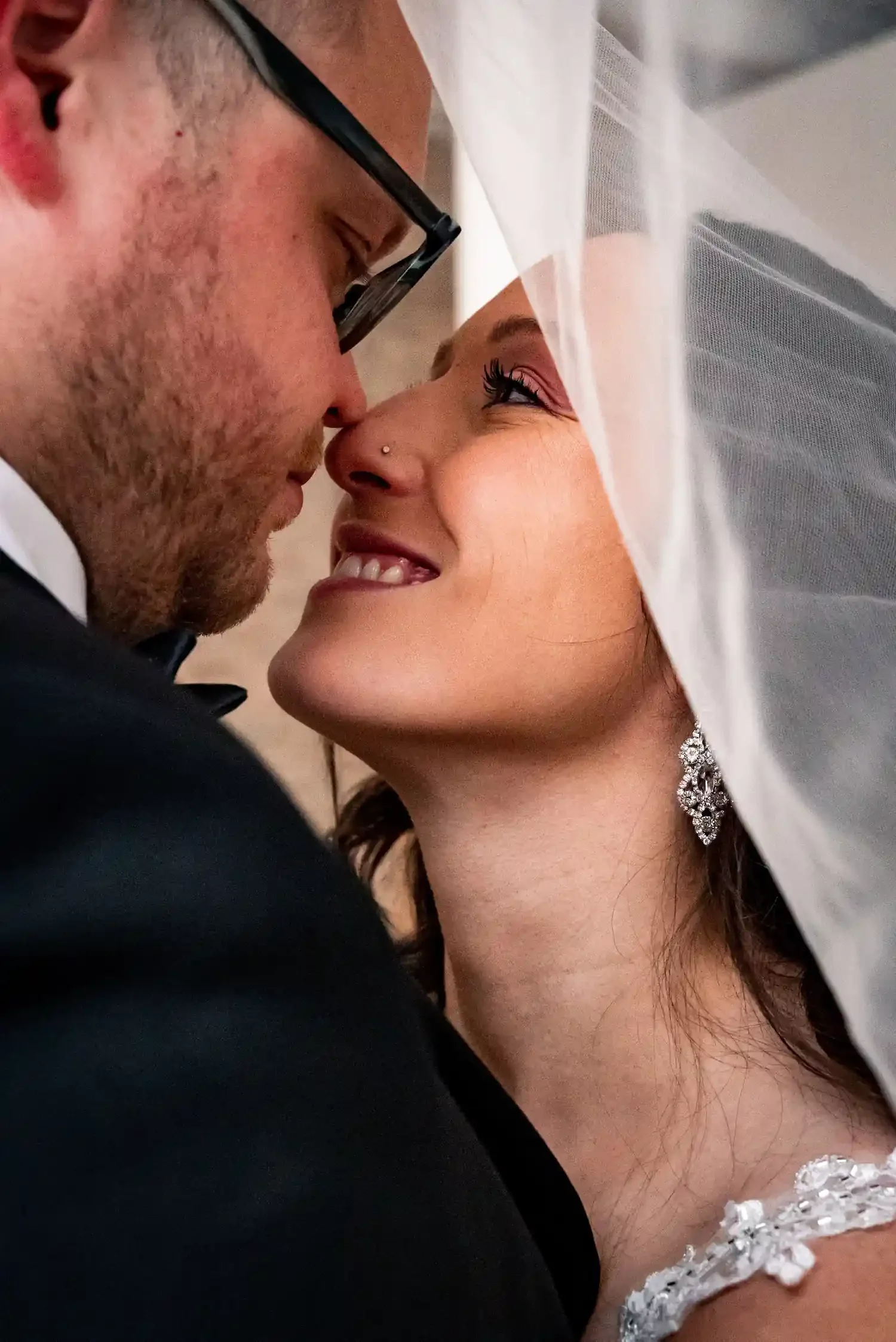 Intimate wedding couple portrait under veil at The Harlow Exchange wedding ceremony venue in Winnipeg's Exchange District