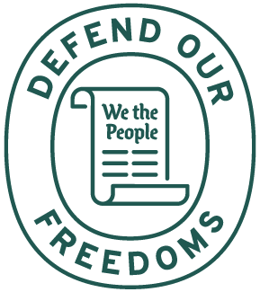 A circular logo with the words "DEFEND OUR FREEDOMS" around the border and a scroll in the center that reads "We the People."