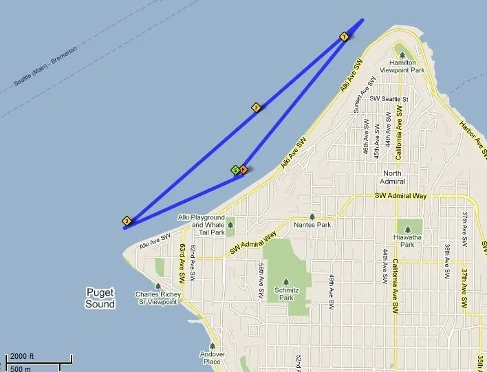 Map showing a short course in Puget Sound, with routes marked in blue, starting and ending at a dock near 36th Ave SW in Seattle, Washington, with landmarks such as Charles Richey Sr. Viewpoint, Alki Playground, and Schmitz Park.