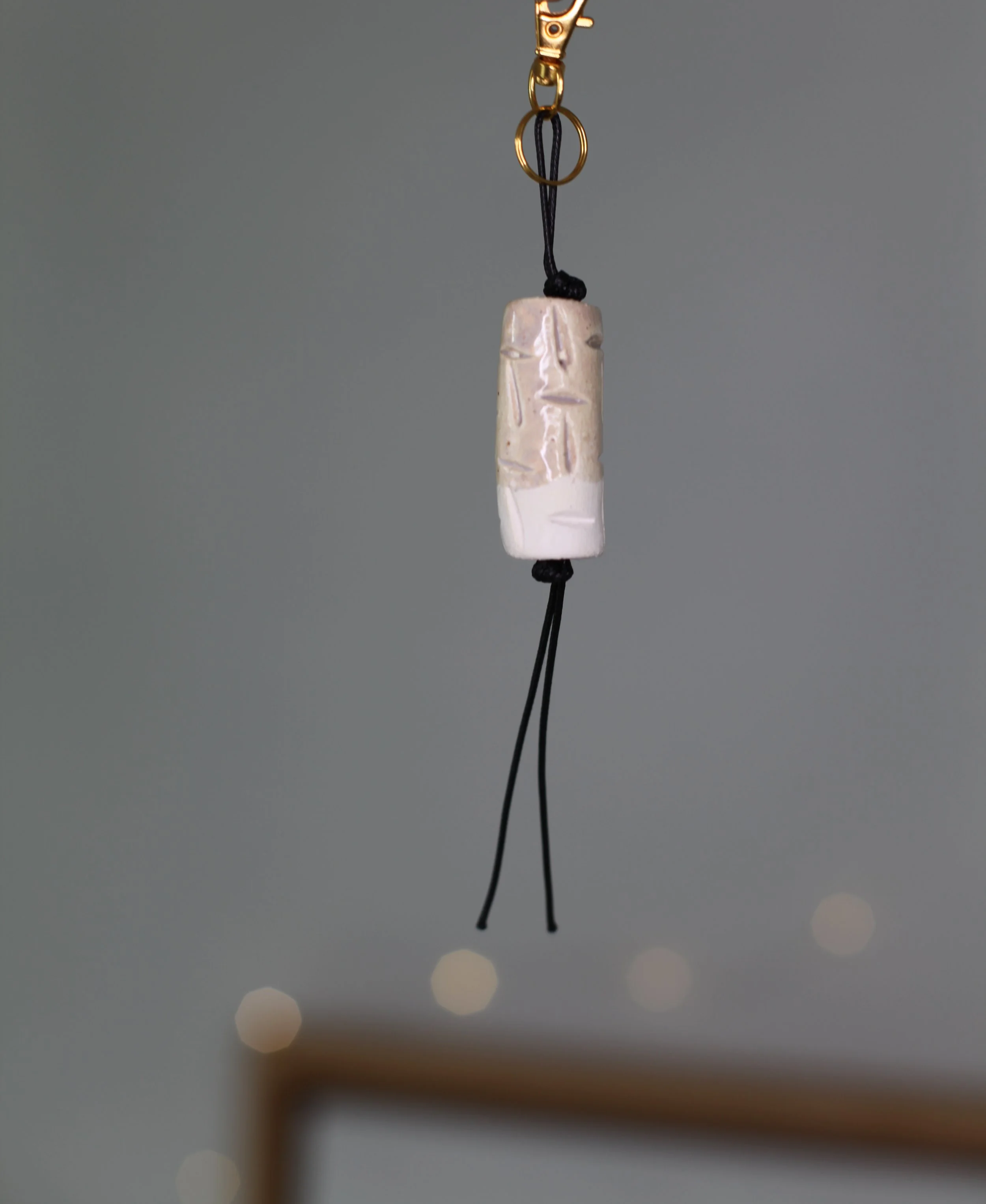 Carved Ceramic Charm