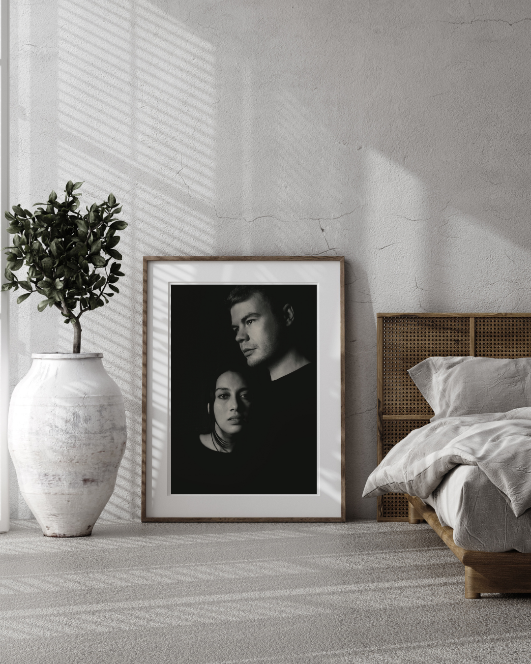 A framed black and white portrait of a couple