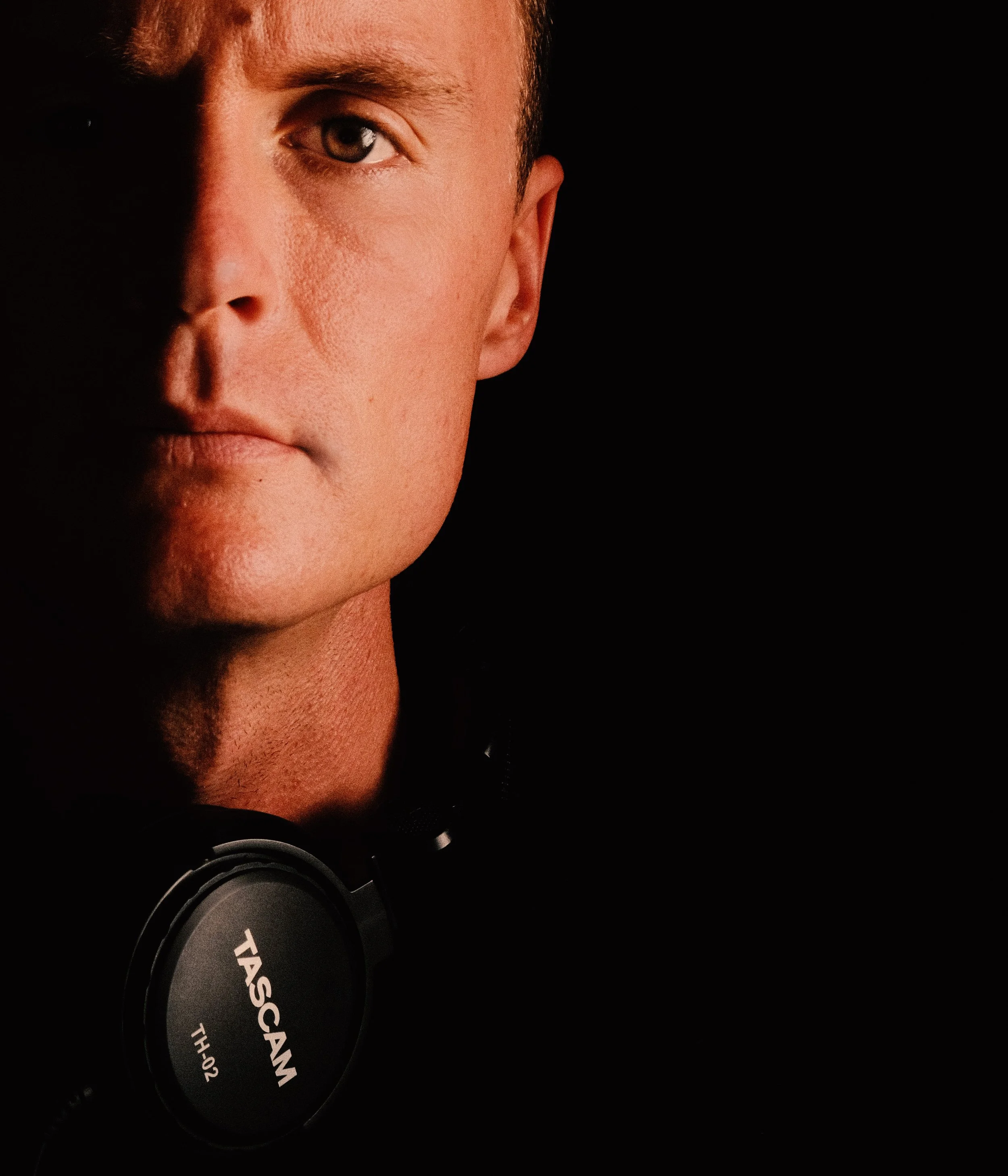 color vintage portrait of DJ with head phone around neck
