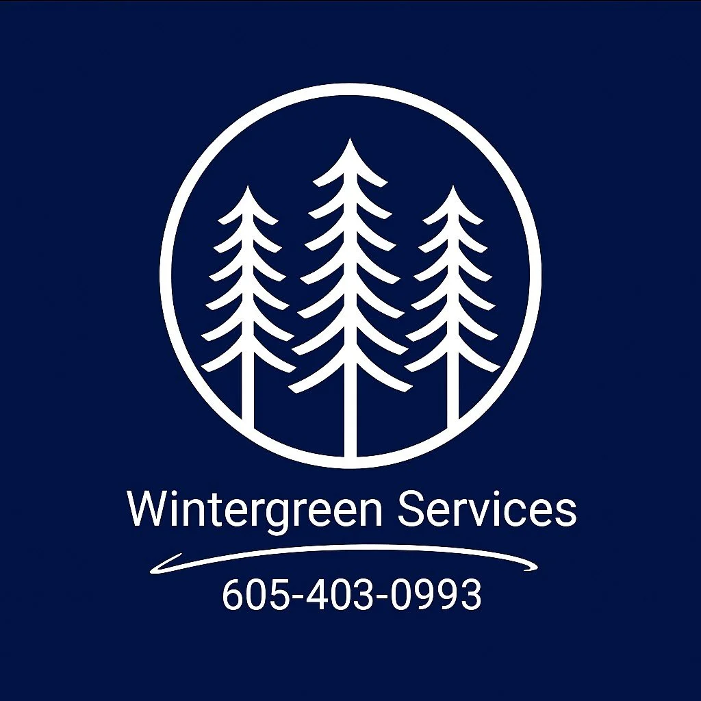 Logo for Wintergreen Services featuring a circle with stylized pine trees inside, company name, and contact number on a navy blue background.