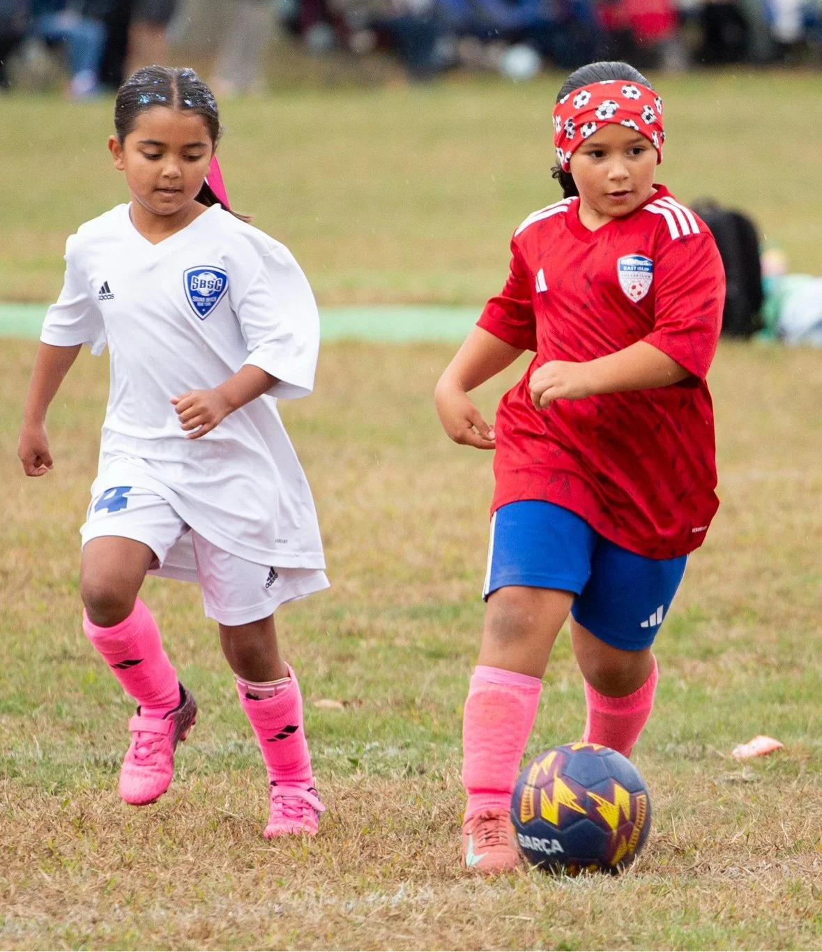 Two young players racing for the ball in a duel — sports photography in Long Island