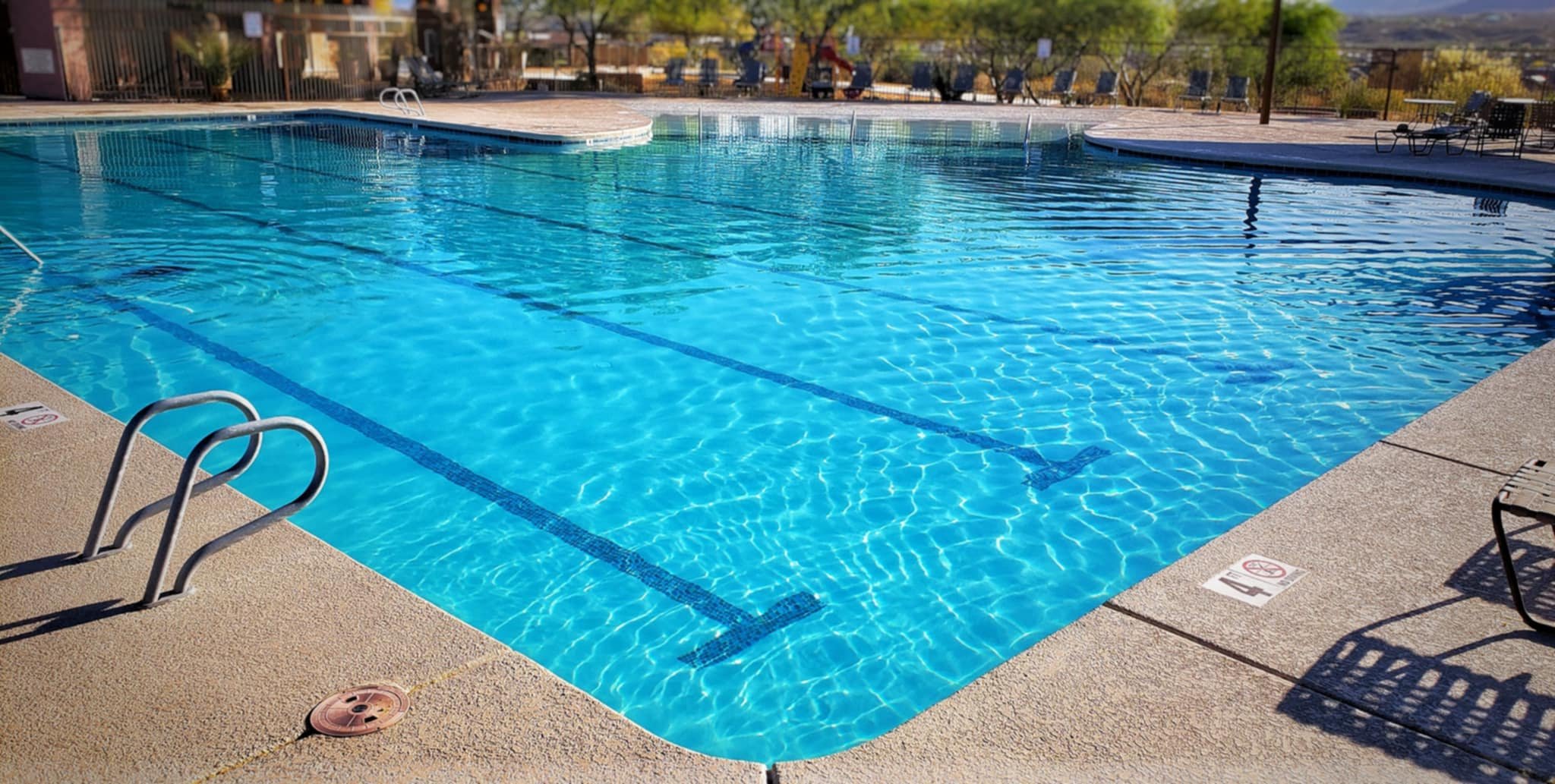 Commercial pool with crystal blue waters, ready for a relaxing few laps or cooling down on hot days.