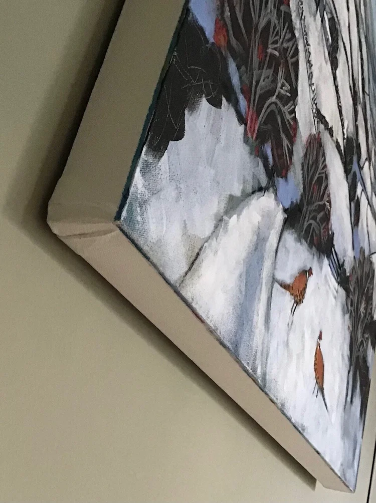 Close-up of a framed painting depicting a snowy landscape with three ducks walking on snow and foliage in the background.