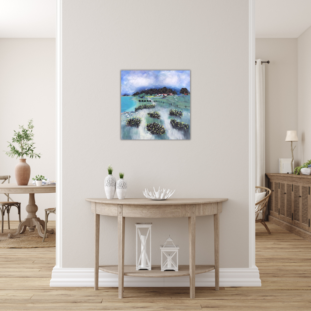 A hallway with a small wooden table against a white wall, decorated with white vases and lanterns, with a colorful landscape painting hanging above.