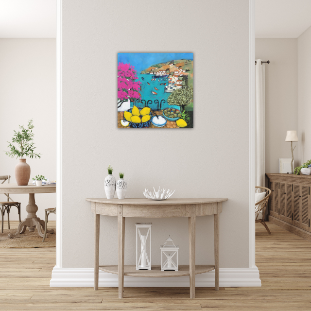 Colorful painting of a coastal village scene with boats, trees, and a blue sky hanging on a white wall in a modern living room.