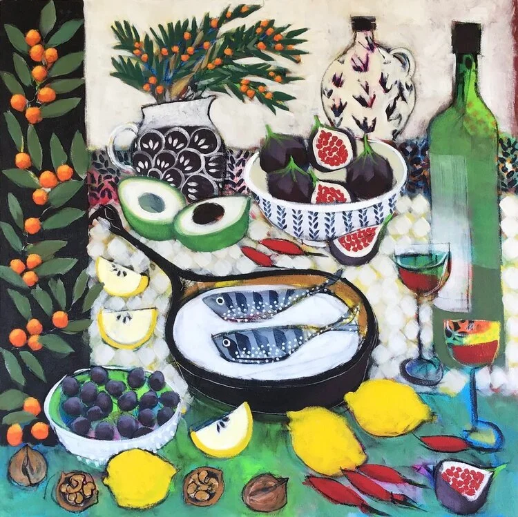 Colorful still life painting of a table with various fruits, a bowl of figs, avocados, black grapes, lemons, pomegranate, red fish, a bottle of wine, wine glasses, and decorative vases with greenery.