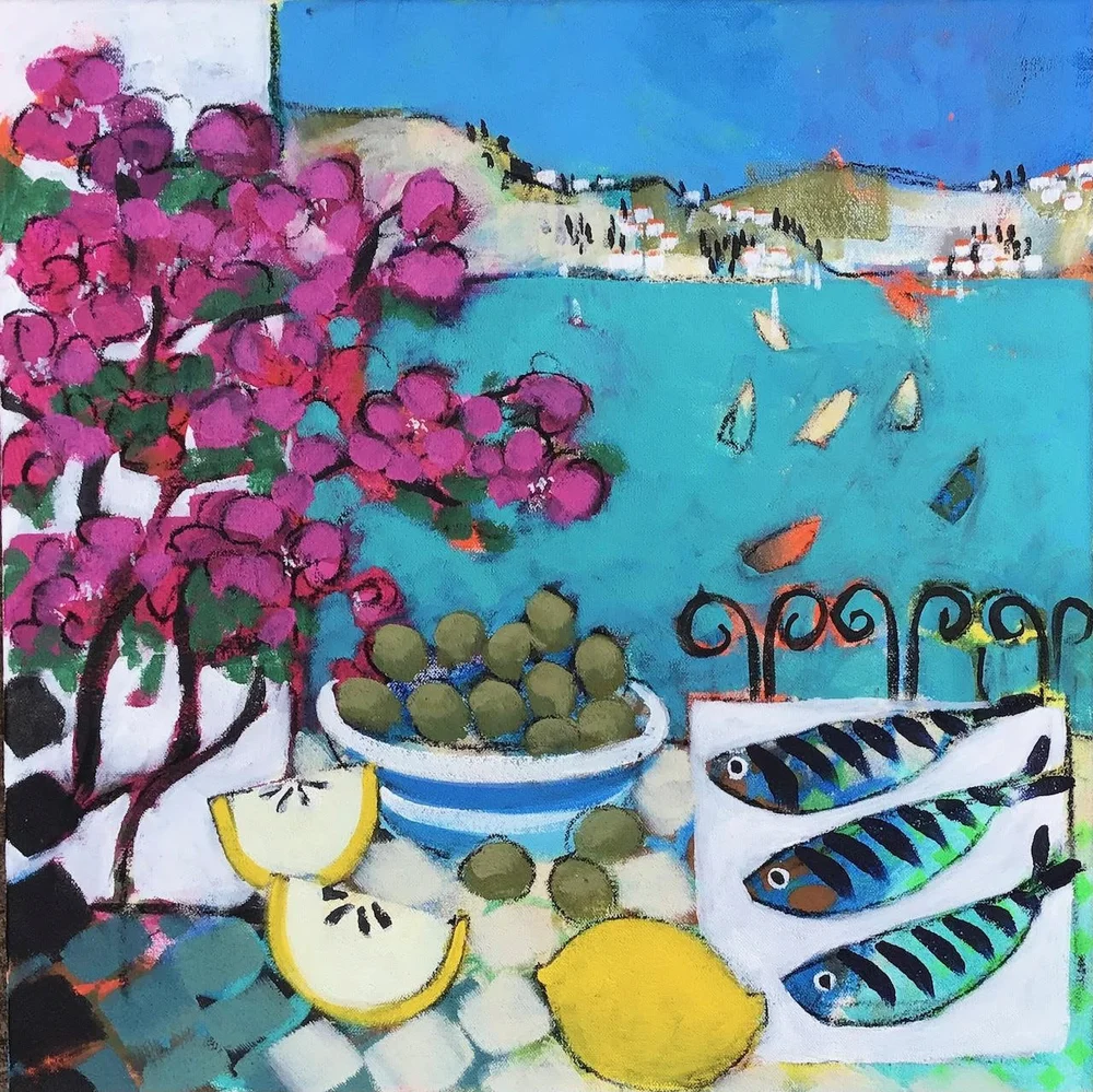 A colorful painting of a seaside scene with pink flowering bush, bowl of green olives, sliced lemon, whole lemon, and three small fish on a white surface. Sailboats are seen on the blue water with a distant shoreline and houses in the background.