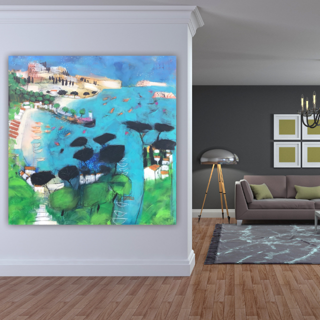 Colorful abstract painting of a coastal landscape hanging on a white wall in a living room with hardwood flooring, next to a gray wall with framed art, a modern floor lamp, a gray sofa with green pillows, chandelier, and a patterned area rug.