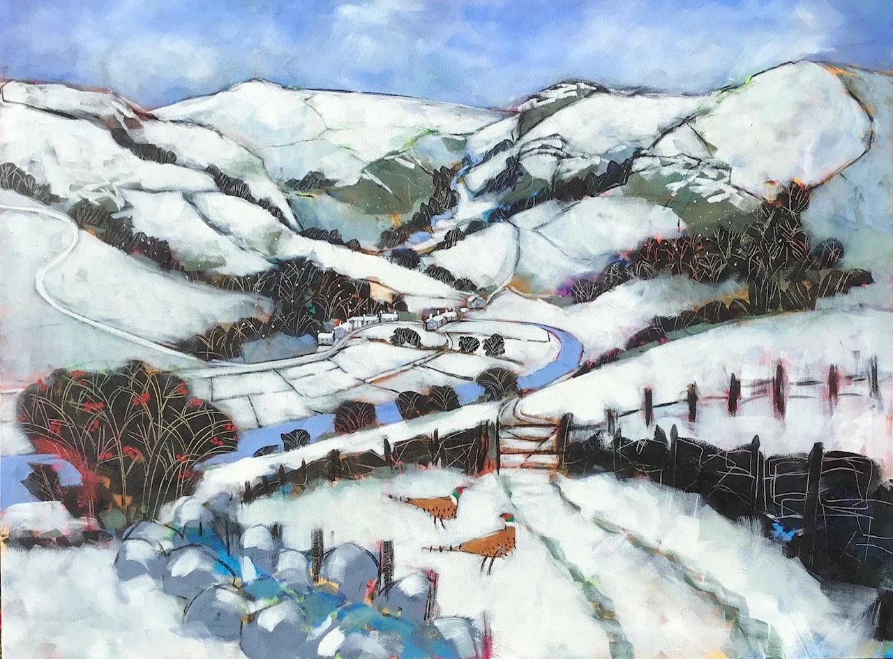 A snowy mountain landscape with winding roads, trees, and a river.