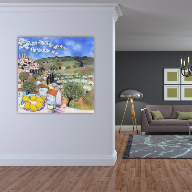 An interior view of a living room with a white wall, a colorful landscape painting, a gray sofa with green pillows, a modern floor lamp, a chandelier, and framed artwork on the dark wall.