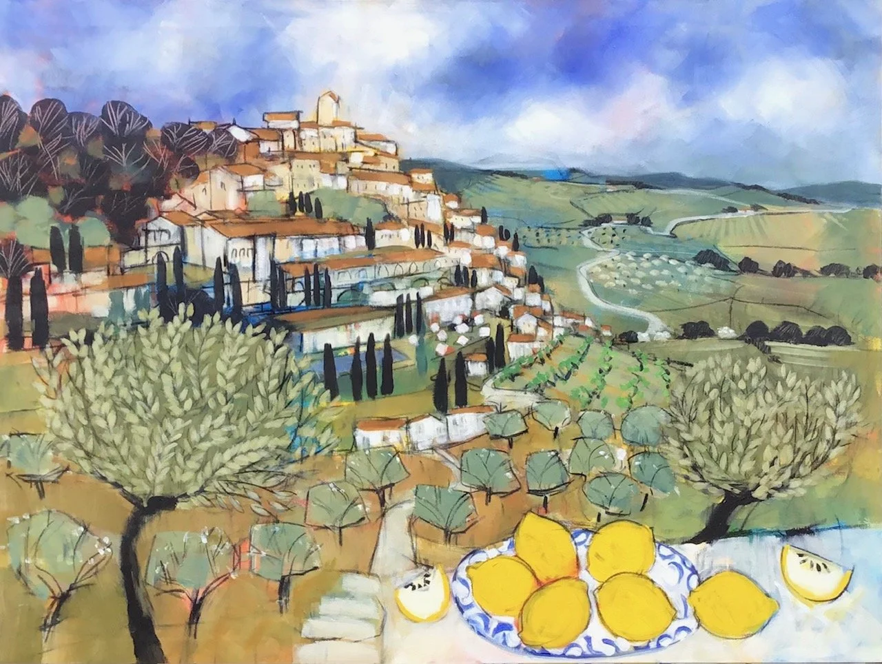 A colorful, impressionistic painting of a hillside village with terracotta roofs, surrounded by trees, vineyards, and rolling green hills under a cloudy sky. In the foreground, there is a plate of lemons and lemon slices.