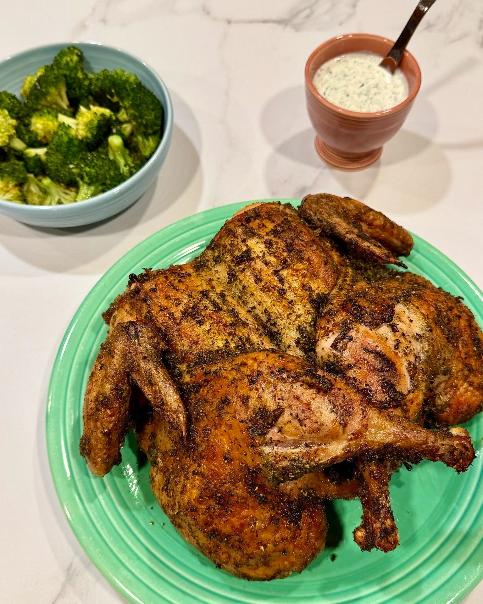 Simple ingredients, incredible flavor 🔥🐔

Our pasture raised whole chickens are the perfect centerpiece for your next meal. Pictured here, spatchcocked, seasoned with an herb rub, and smoked to perfection, then paired with a fresh, cool tzatziki sa