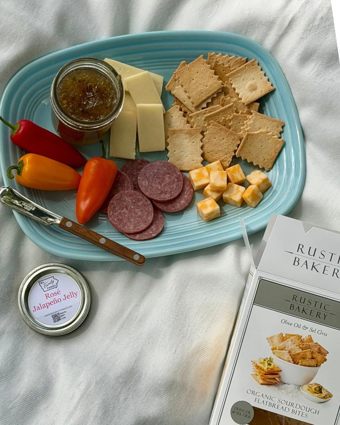 Memorial Day weekend is the perfect time to get outside, enjoy the weather, and put together a quick charcuterie board or picnic spread. ☀️🧺

Pictured is BA Family Farms Ros&egrave; Jalape&ntilde;o Jelly paired with summer sausage and cheese, along 