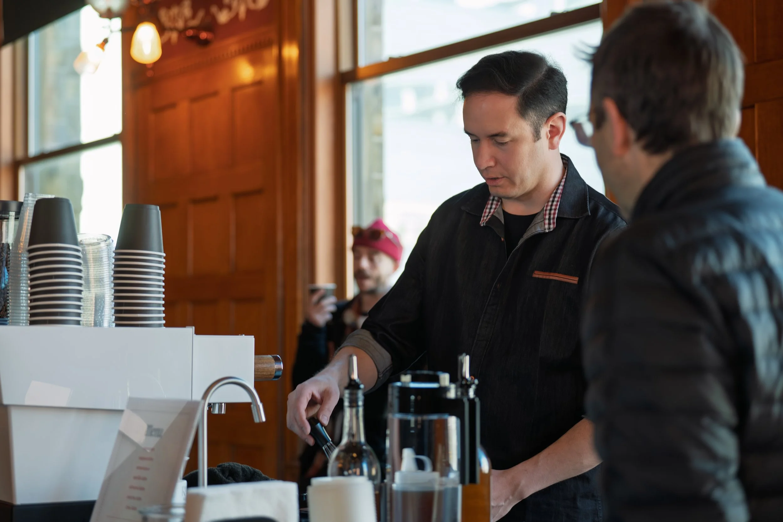 Owner Mark Pape of Preamble Coffee Cart Catering in Fort Wayne, Indiana speaking to satisfied guests who ordered coffee at a private event.