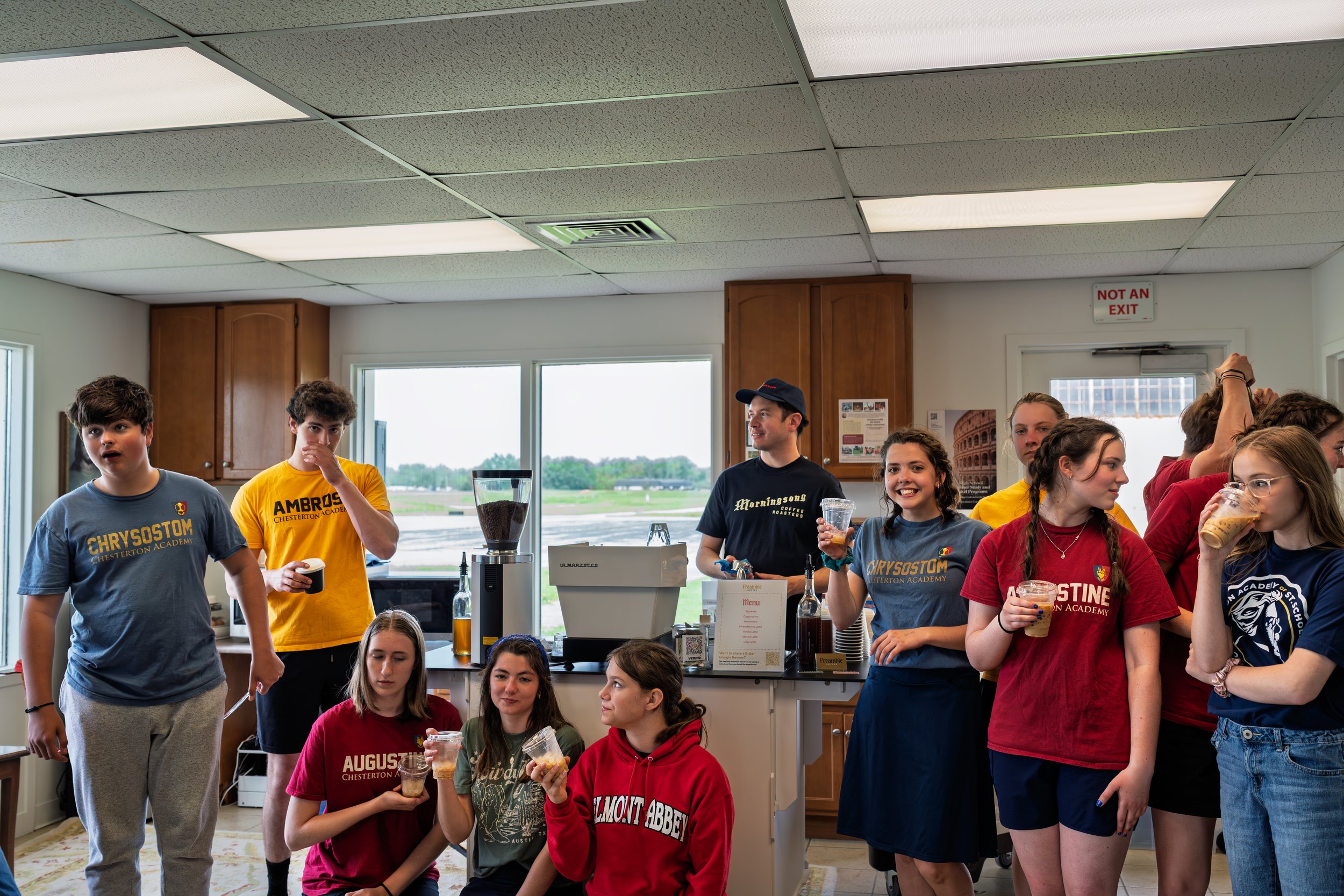 Preamble Coffee Cart Catering in Fort Wayne, Indiana surrounded by students enjoying coffee prepared for them at a private event.