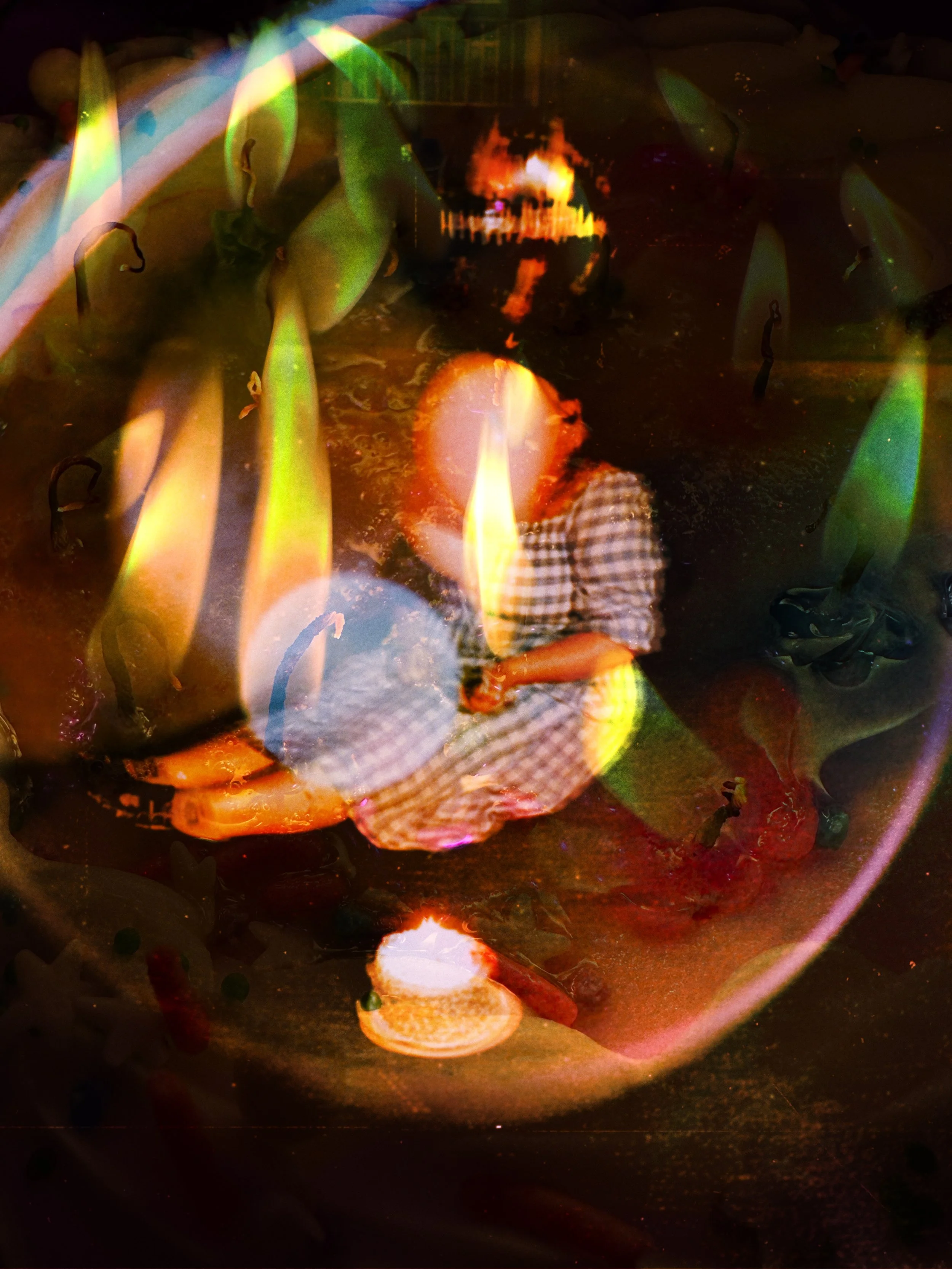 A person with a checkered shirt sitting on the ground, surrounded by flame-like light effects, reflections, and abstract shapes, creating a layered, surreal visual.