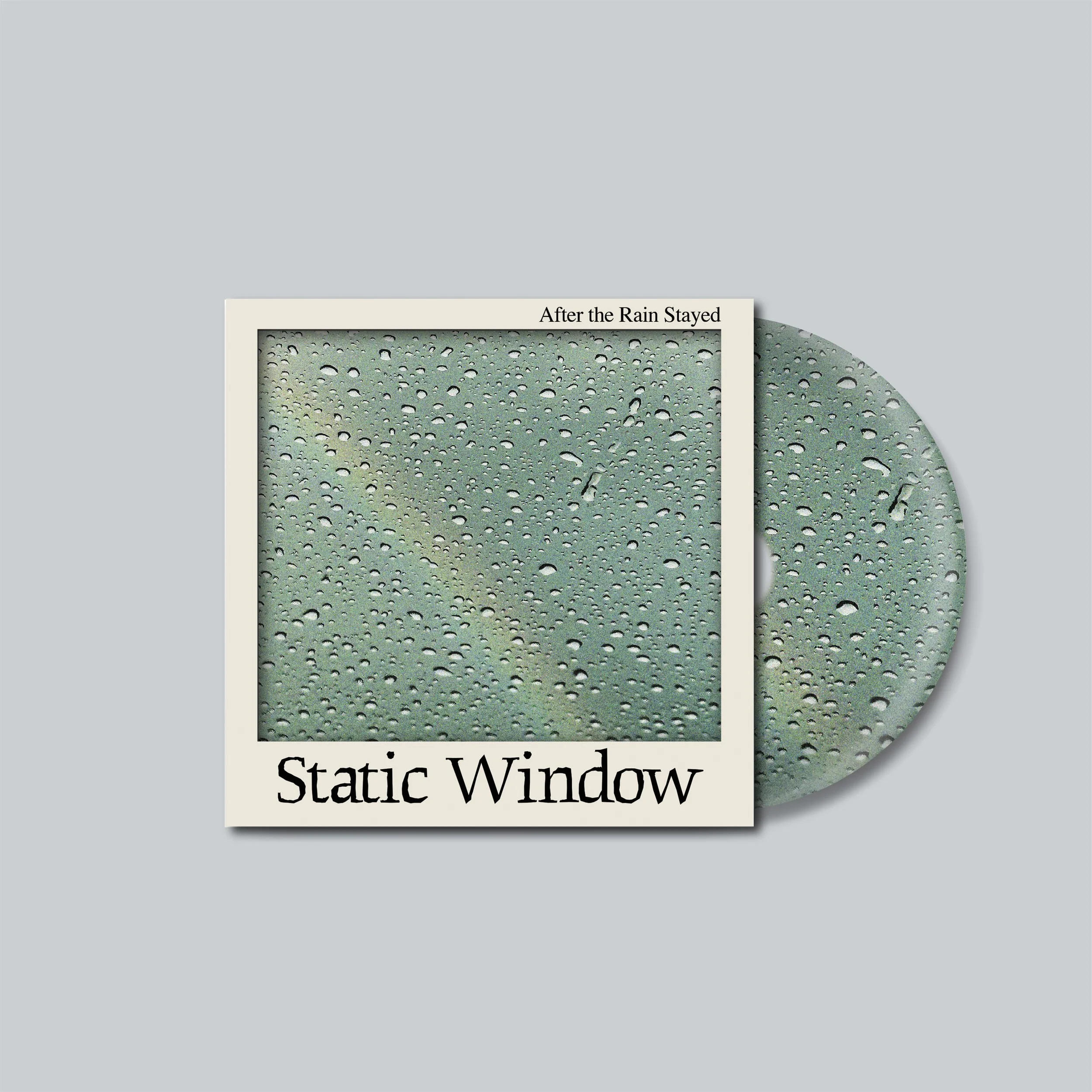 Album cover titled 'Static Window' with water droplets on a windowpane after rain, and CD partially visible behind the cover.