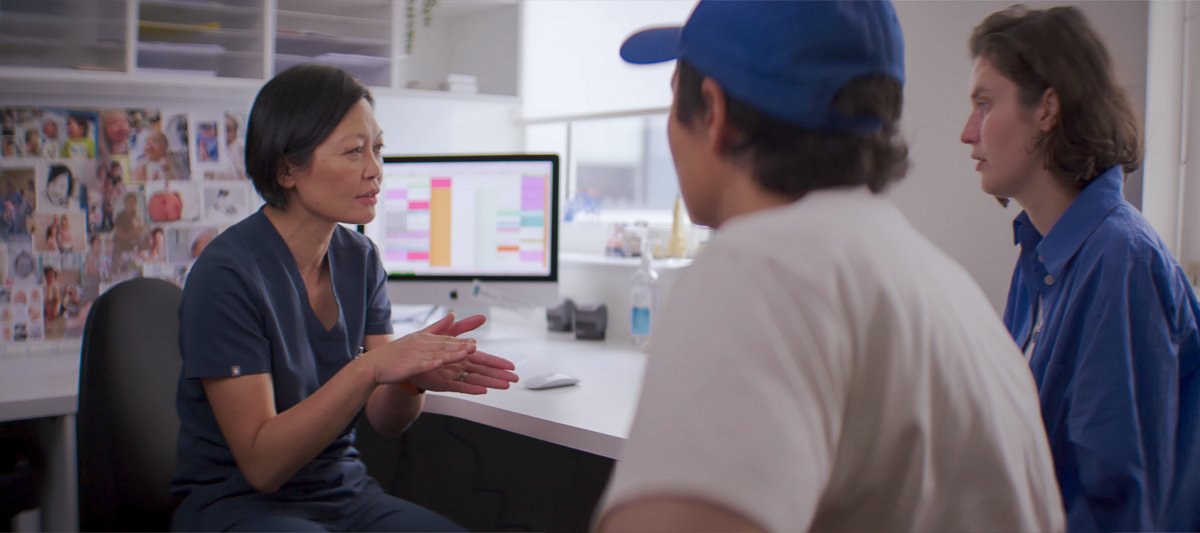 dr renee wong talking to patients in consultation