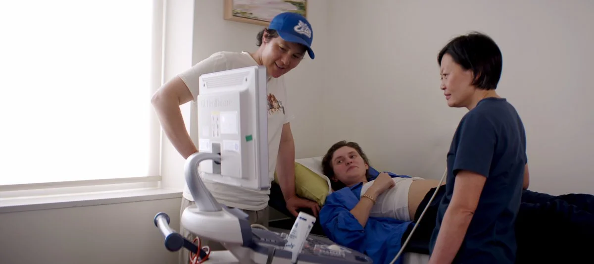 female doctor taking ultrasound of pregnant patient