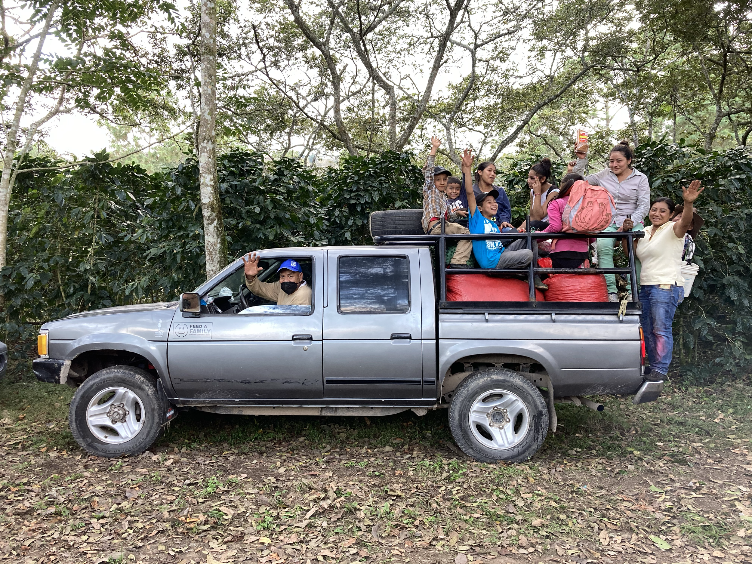 Giving a ride to coffee pickers after a long day of work.