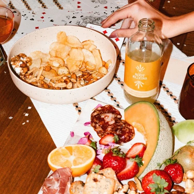Sparkling mocktails on table with trail mix
